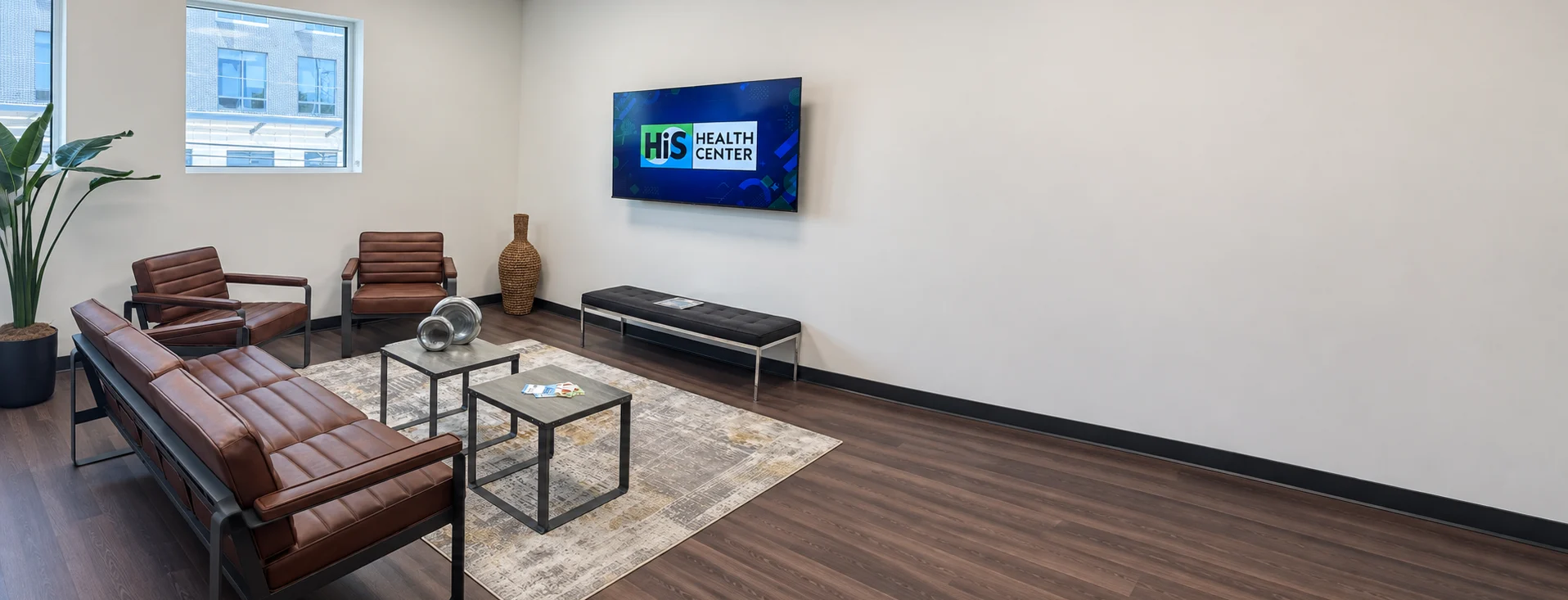 The HiS Health Center lobby, with the HiS Health Center screen on the wall